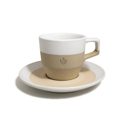 Brown ceramic mug with white glaze and matching saucer.