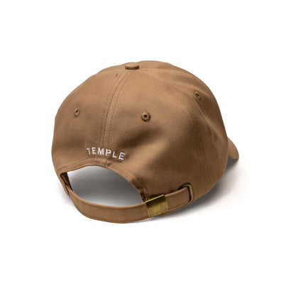 Backside of a Dune (Light Brown/Beige) colored "Dad" Style Baseball Cap with the word "Temple" embroidered in White.