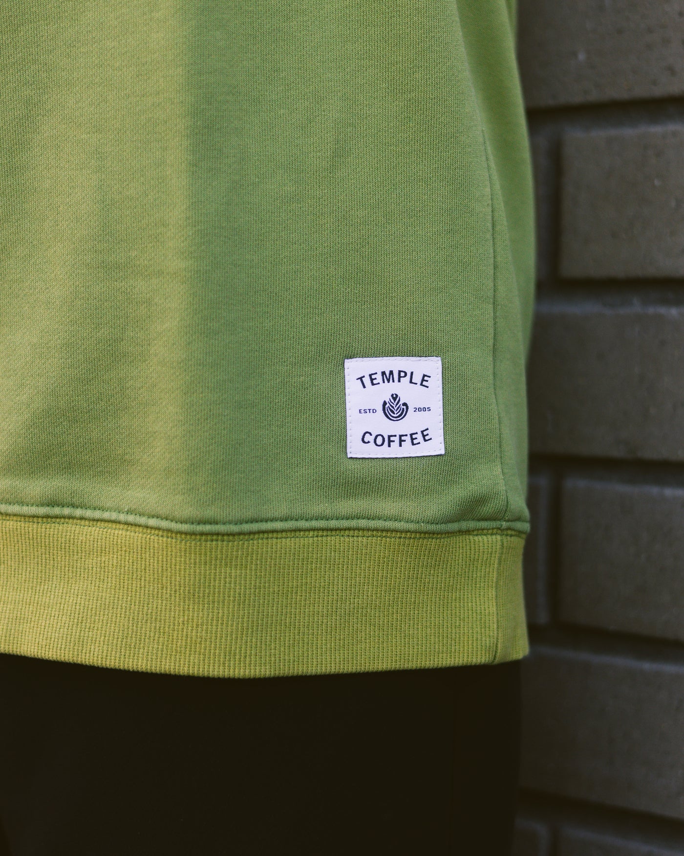 Green Crewneck Sweater with "COFFEE" sewn on and a Temple Coffee patch.