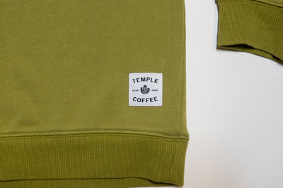 Green Crewneck Sweater with "COFFEE" sewn on and a Temple Coffee patch.