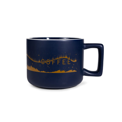Navy blue mug with 'COFFEE' in gold on a white background