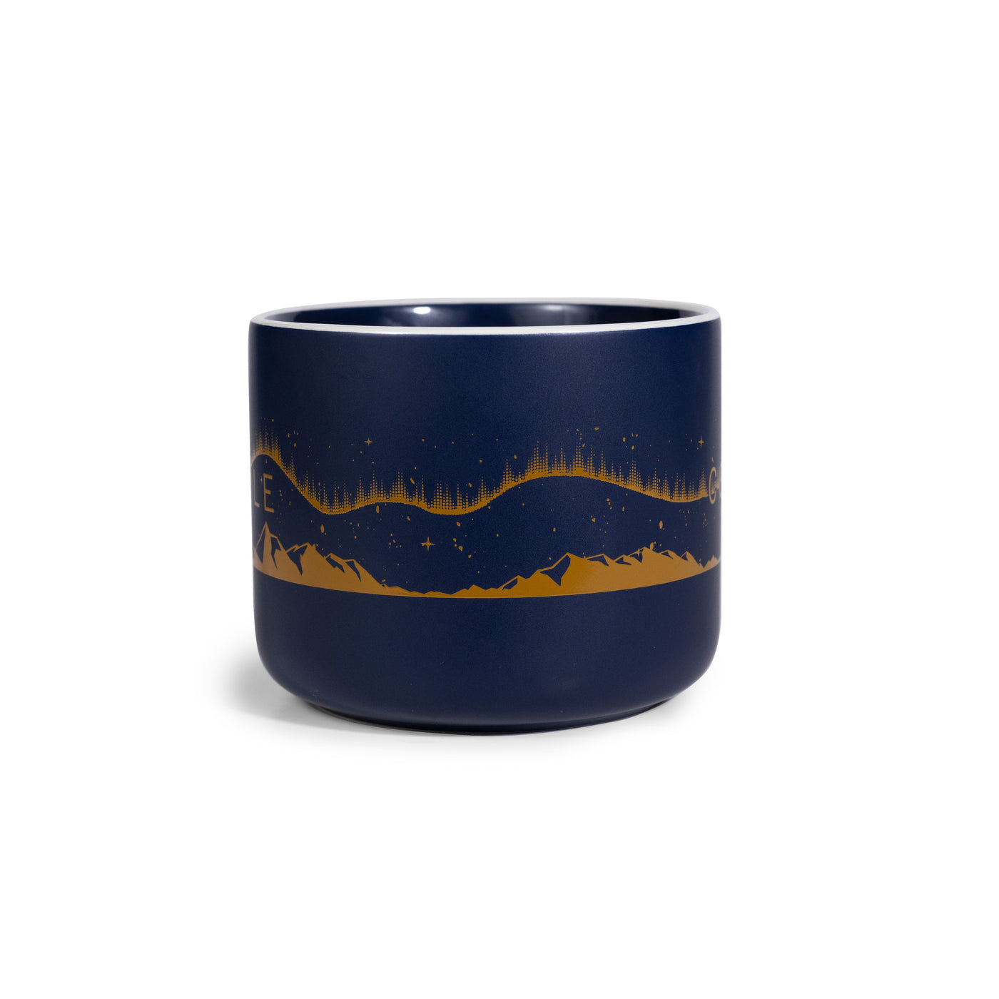 Navy blue mug with mountain and star design on a white background.