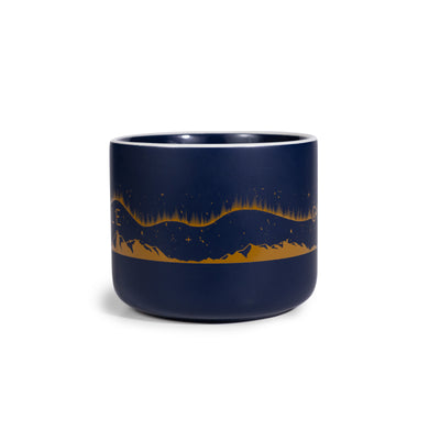Navy blue mug with mountain and star design on a white background.