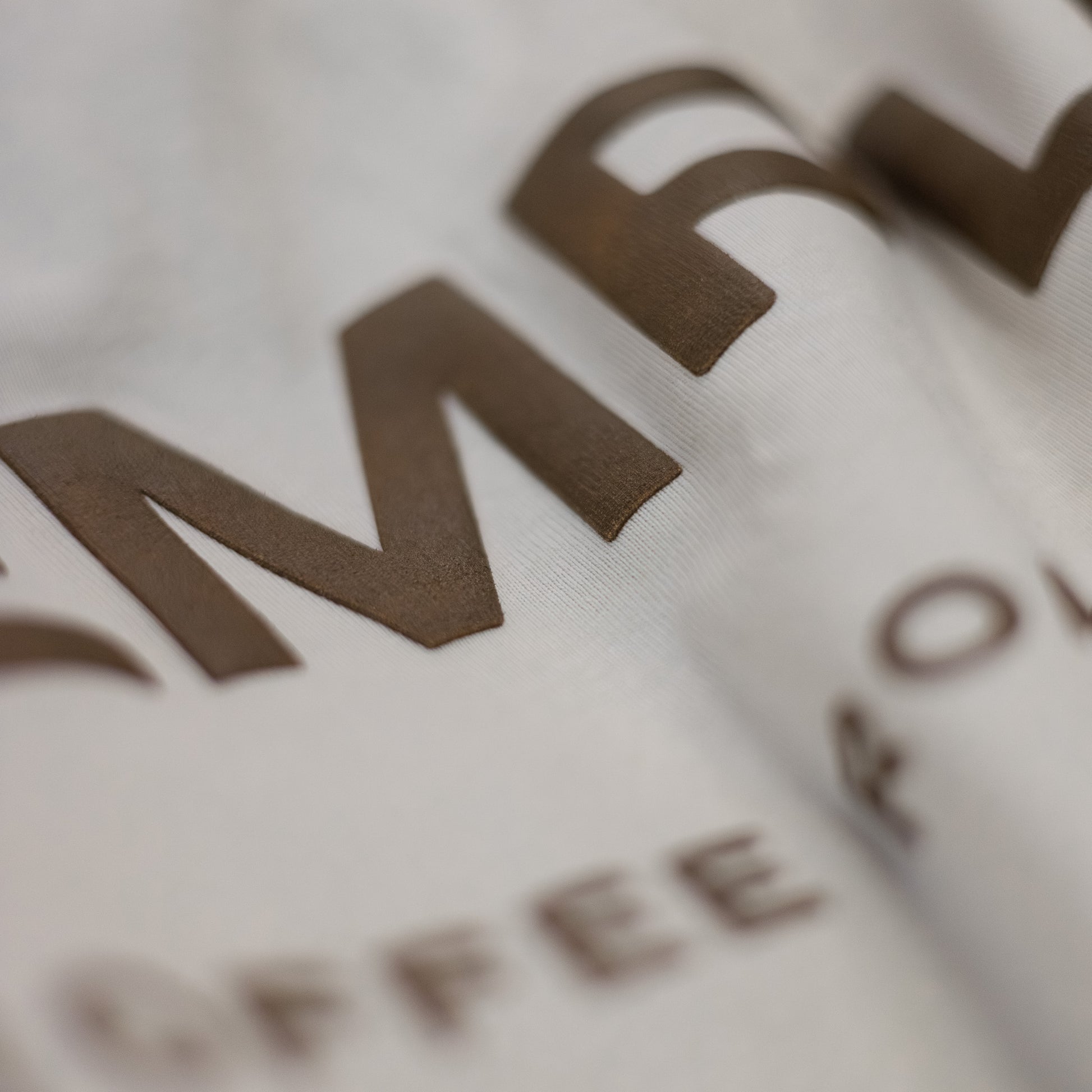 Close-up of a brown logo on a white background