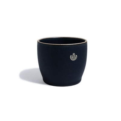 Navy blue porcelain mug with rosetta design.