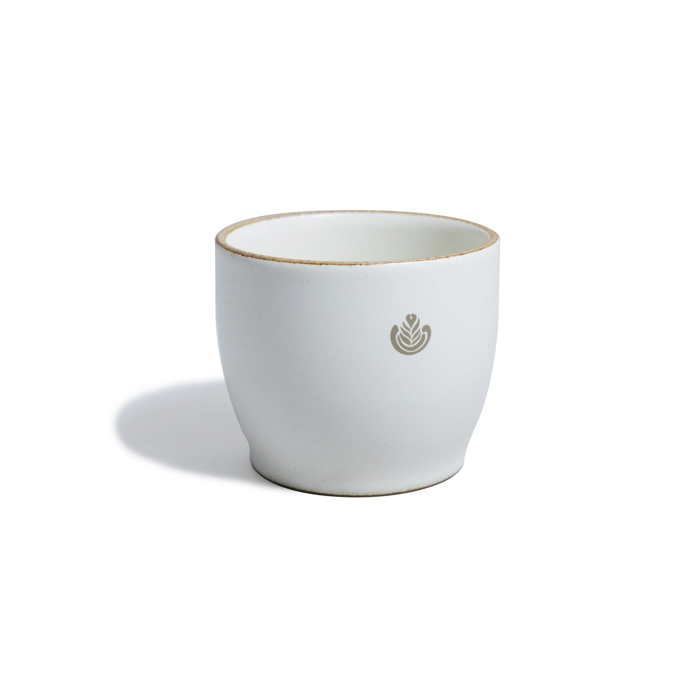 White porcelain mug with rosetta design.