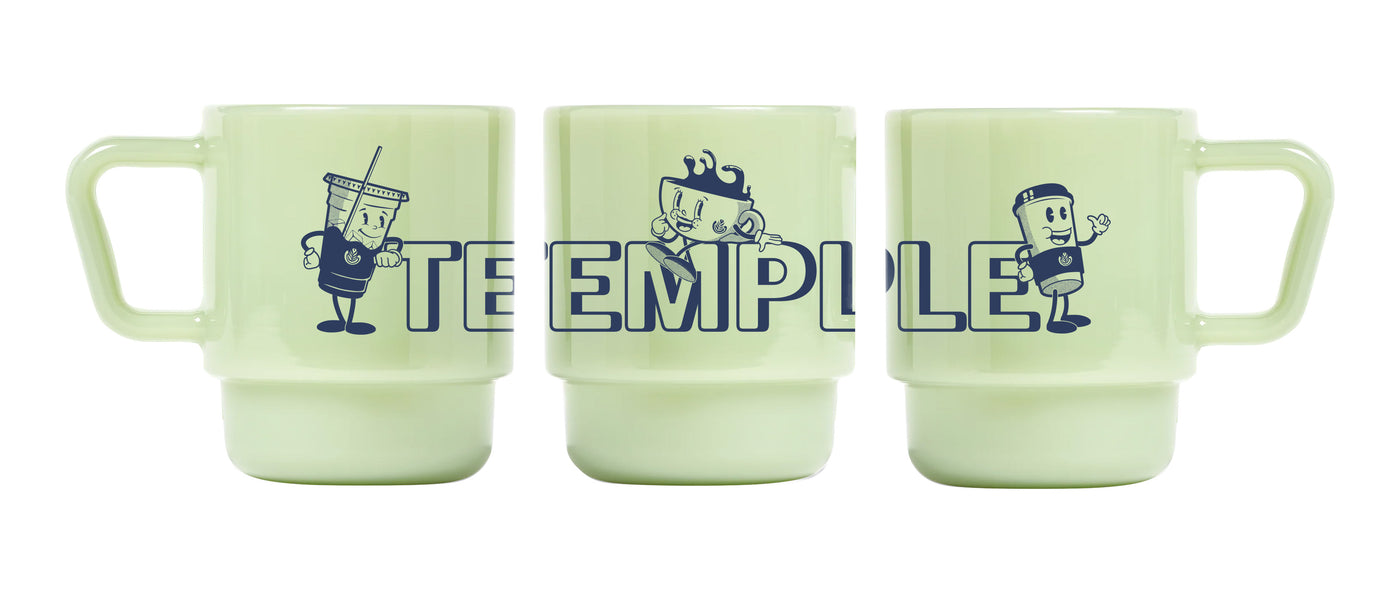 Three light green mugs with blue graphics and text on a white background