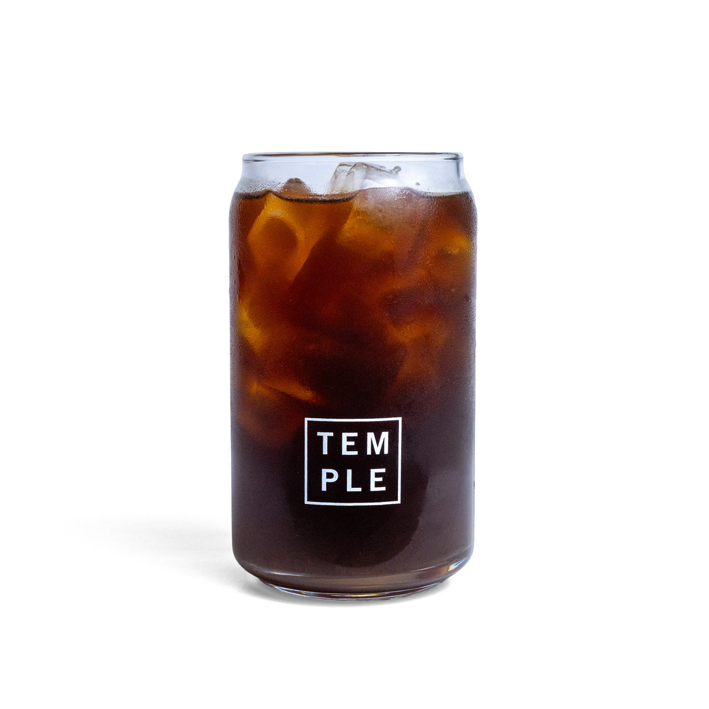 Clear Glass Can with Temple logo filled with Cold Brew
