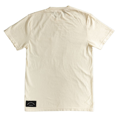 Back of a Cream-colored T-shirt featuring a 'Hand Crafted Since 2005' tag printed above the hem on the lower left side.